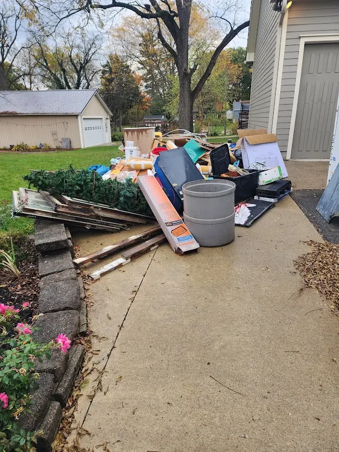 Dumpster being loaded with debris for Commercial Dumpster Rental in Las Vegas